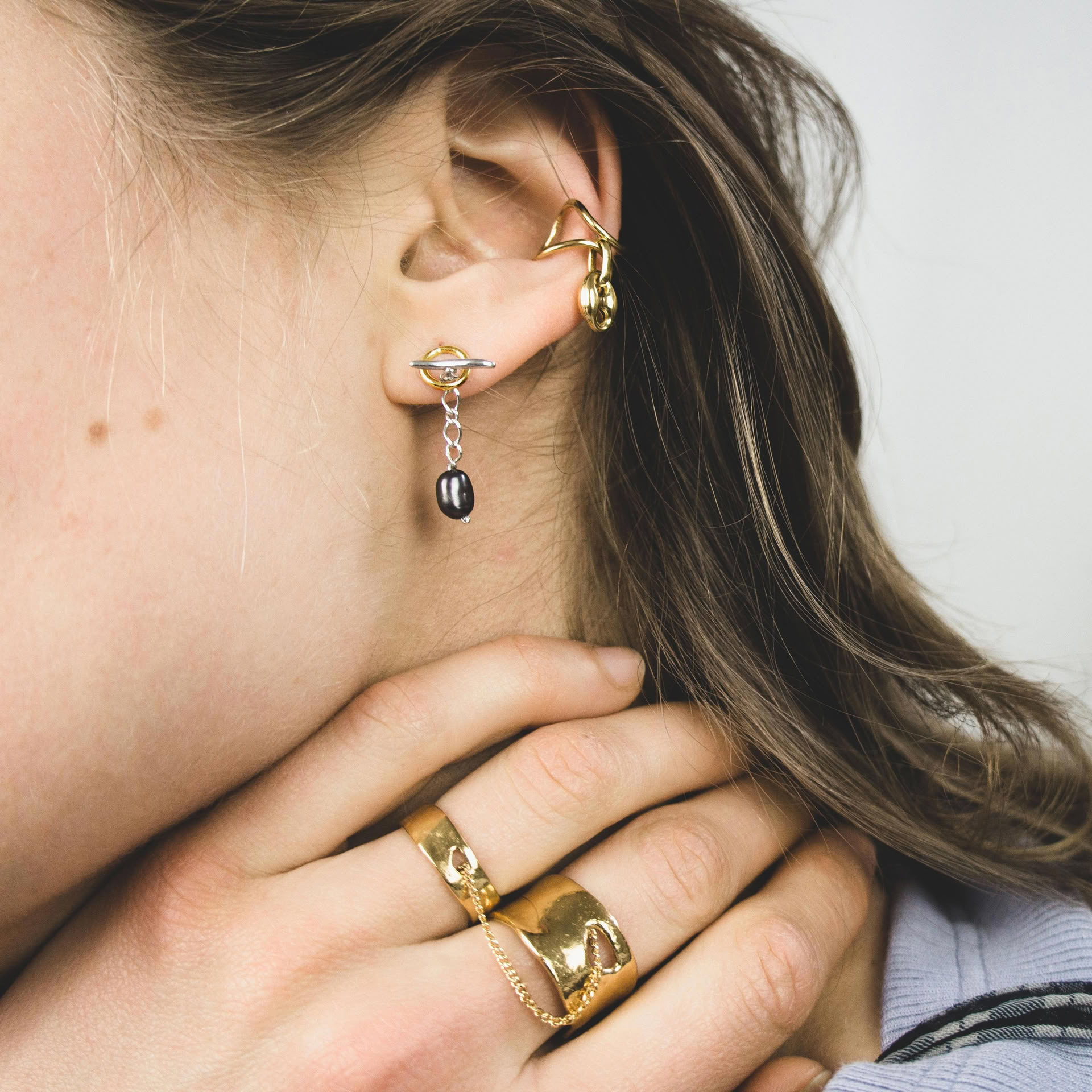 Kagun trio of earrings in mix of silver and gold plated silver, with minimalist shapes and fresh water pearls