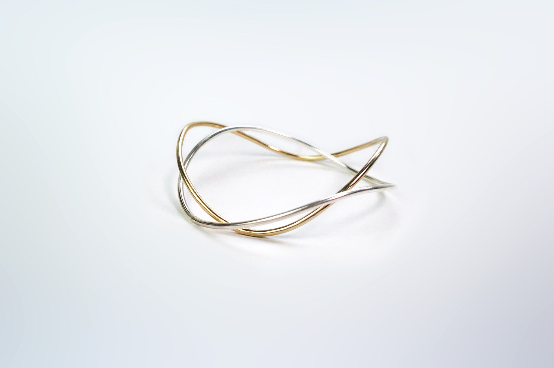 Hadou wavy blangles in silver and gold plated silver.